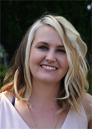 Portrait of Woman in Open Shade. Woman smiling in vertically oriented photograph shows the flattering qualities of open shade.